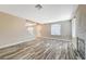 Living room with wood-look floors and fireplace at 5040 Sublight Ave, Las Vegas, NV 89108