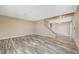 Spacious living room with wood-look floors at 5040 Sublight Ave, Las Vegas, NV 89108