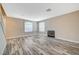 Living room with wood-look floors and fireplace at 5040 Sublight Ave, Las Vegas, NV 89108