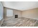 Living room with wood-look floors and fireplace at 5040 Sublight Ave, Las Vegas, NV 89108