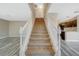 Elegant staircase with white railings and carpeted steps at 5040 Sublight Ave, Las Vegas, NV 89108