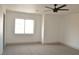 Bright bedroom with carpeted floors and ceiling fan at 5347 Reardon Ct, North Las Vegas, NV 89031