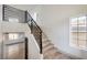 Modern staircase with metal railing and wood steps at 5347 Reardon Ct, North Las Vegas, NV 89031