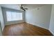 Bright bedroom with hardwood floors and ceiling fan at 5710 E Tropicana Ave # 1196, Las Vegas, NV 89122