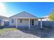 Backyard with covered patio and grassy area at 5916 Naperville St, Las Vegas, NV 89130