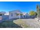 Backyard with covered patio and grassy area at 5916 Naperville St, Las Vegas, NV 89130