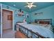 Bedroom with blue walls, ceiling fan, and a comfortable bed at 5916 Naperville St, Las Vegas, NV 89130