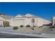 Single-story house with a two-car garage and desert landscaping at 5916 Naperville St, Las Vegas, NV 89130