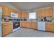 Kitchen boasts ample counter space and oak cabinetry at 5916 Naperville St, Las Vegas, NV 89130
