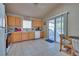 Open kitchen with dining area and sliding door to patio at 5916 Naperville St, Las Vegas, NV 89130
