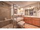 Elegant bathroom with double vanity, soaking tub and shower at 64 Strada Principale # 205, Henderson, NV 89011