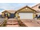 House exterior featuring a brick walkway and attached garage at 6442 Cedar Breaks Ave, Las Vegas, NV 89156