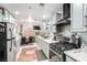 Modern kitchen with stainless steel appliances and light gray cabinets at 6442 Cedar Breaks Ave, Las Vegas, NV 89156