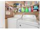Laundry room with washer, dryer, and overhead shelving at 6442 Cedar Breaks Ave, Las Vegas, NV 89156