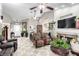 Spacious living room featuring tile floors, fireplace, and ample natural light at 6442 Cedar Breaks Ave, Las Vegas, NV 89156