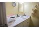 Bright bathroom featuring vanity with white countertop and ample storage at 6443 Silverfield Dr, Las Vegas, NV 89103