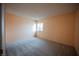 Spacious bedroom with plush carpeting and a bright window at 6443 Silverfield Dr, Las Vegas, NV 89103