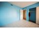 Clean bedroom featuring a closet and tile floors; doorway visible at 6443 Silverfield Dr, Las Vegas, NV 89103