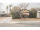 House exterior showcasing a tree and driveway at 6443 Silverfield Dr, Las Vegas, NV 89103