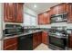 Updated kitchen featuring stainless steel appliances and granite countertops at 6443 Silverfield Dr, Las Vegas, NV 89103
