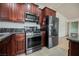Updated kitchen featuring stainless steel appliances and granite countertops at 6443 Silverfield Dr, Las Vegas, NV 89103