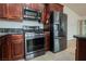 Updated kitchen featuring stainless steel appliances and granite countertops at 6443 Silverfield Dr, Las Vegas, NV 89103