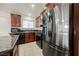 Kitchen boasts stainless steel appliances and dark wood cabinetry at 6443 Silverfield Dr, Las Vegas, NV 89103