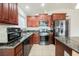 Close-up of the renovated kitchen with modern appliances and granite countertops at 6443 Silverfield Dr, Las Vegas, NV 89103