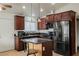 Functional kitchen with granite countertops, black appliances, and ample cabinet space at 6443 Silverfield Dr, Las Vegas, NV 89103