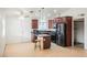 Well-equipped kitchen includes an island with seating and dark brown cabinetry at 6443 Silverfield Dr, Las Vegas, NV 89103