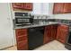 Updated kitchen featuring stainless steel appliances and granite countertops at 6443 Silverfield Dr, Las Vegas, NV 89103