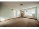 Inviting living room with carpeted floor and ample natural light at 6443 Silverfield Dr, Las Vegas, NV 89103