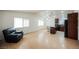 Inviting living room with wood flooring, natural light and an adjoining kitchen at 6443 Silverfield Dr, Las Vegas, NV 89103