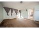Bright living room boasting carpet flooring and natural light at 6443 Silverfield Dr, Las Vegas, NV 89103