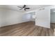 Open living room with hardwood floors and access to stairs at 705 N Torrey Pines Dr, Las Vegas, NV 89107