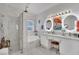 Beautiful bathroom features a glass-enclosed shower, soaking tub and a double vanity with lighted mirrors at 725 Pacific Cascades Dr, Henderson, NV 89012