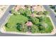 A bird's eye view of a common area with a gazebo, mature trees, and grassy space at 725 Pacific Cascades Dr, Henderson, NV 89012