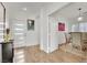 Bright entryway with wood floors leads to dining room, complete with modern front door and stylish decor at 725 Pacific Cascades Dr, Henderson, NV 89012