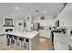 Bright kitchen with white cabinets, stainless appliances, and a large island with seating at 725 Pacific Cascades Dr, Henderson, NV 89012