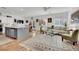 Open concept floorplan seamlessly connects the living room to the kitchen and dining area at 725 Pacific Cascades Dr, Henderson, NV 89012