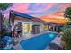 Backyard pool with solar panels and a patio, perfect for outdoor relaxation and entertaining at 725 Pacific Cascades Dr, Henderson, NV 89012