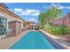 A private pool with patio space, attractive tile work and lush landscaping at 725 Pacific Cascades Dr, Henderson, NV 89012