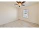 Spacious bedroom with ceiling fan and wood-look floors at 7652 Calico Fields St, Las Vegas, NV 89149