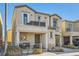 Two-story house with balcony, two-car garage, and landscaped front yard at 7652 Calico Fields St, Las Vegas, NV 89149