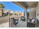 Covered front porch with seating for relaxing at 7652 Calico Fields St, Las Vegas, NV 89149