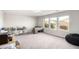 Large bonus room with carpet flooring and three bright sunny windows at 7733 Rosebark Cliffs St, North Las Vegas, NV 89084