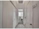 Bright hallway with tile flooring and access to bedrooms at 7908 Mountain Point Ave, Las Vegas, NV 89131