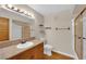 Bathroom features wood cabinets and a shower/tub combo at 7950 W Flamingo Rd # 1041, Las Vegas, NV 89147
