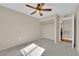 Spacious bedroom with ceiling fan, closet, and neutral decor at 7950 W Flamingo Rd # 1041, Las Vegas, NV 89147