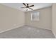Well-lit bedroom featuring a ceiling fan and neutral carpet at 7950 W Flamingo Rd # 1041, Las Vegas, NV 89147